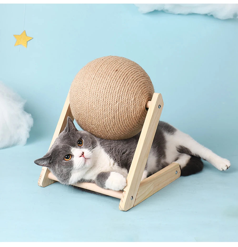 Cat lying in the base of the scratching ball