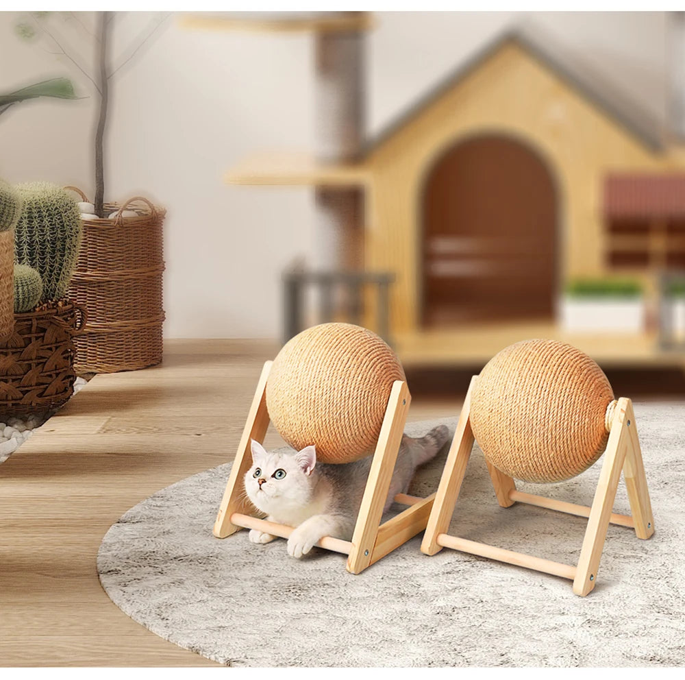 Scratching balls on a base in front of a small cat house