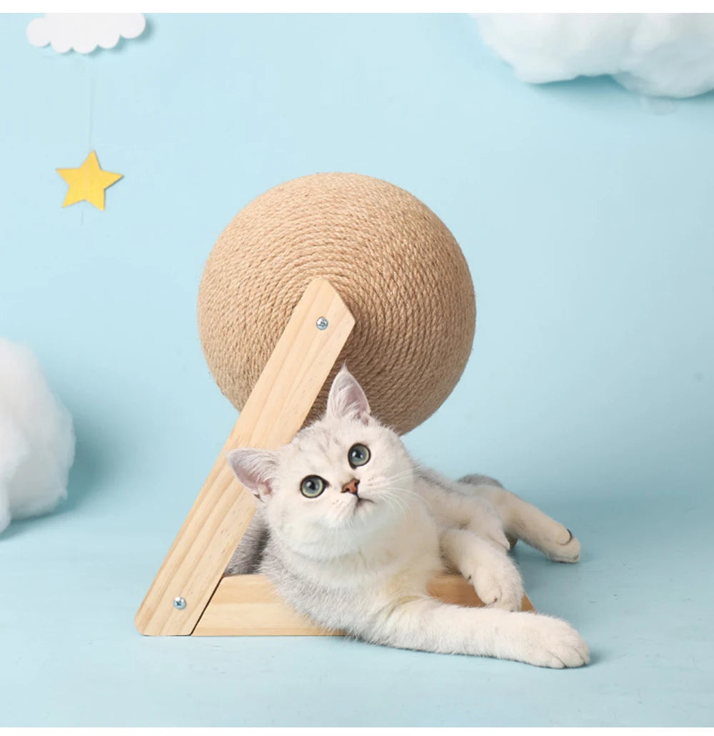 Cat playing under the sisal scratching ball