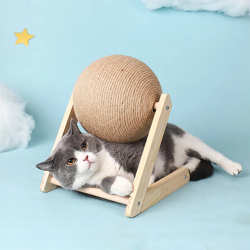 Cat lying under the sisal scratching ball