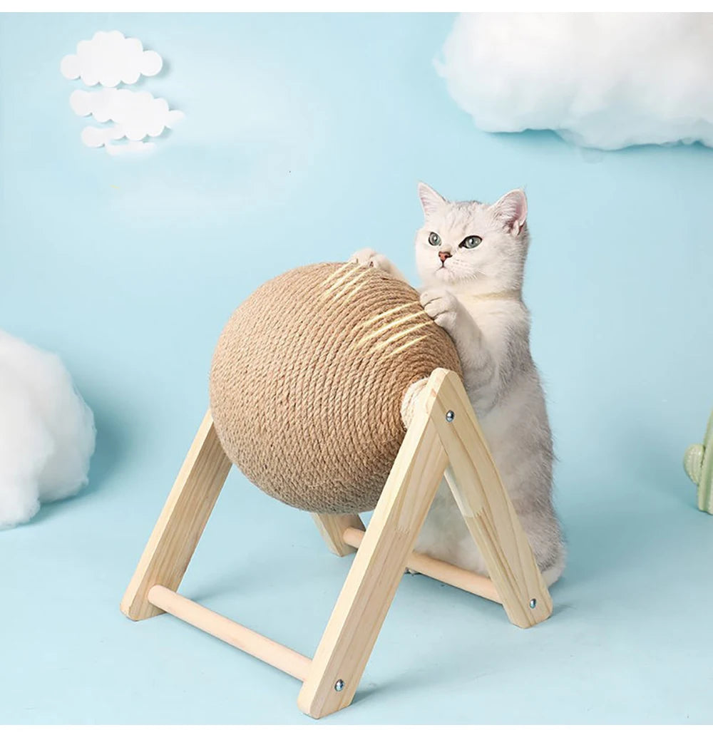 Cat catching the sisal scratching ball