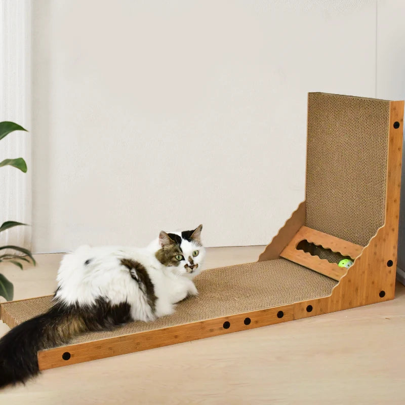 Cat playing on the base of the cardboard scratching post