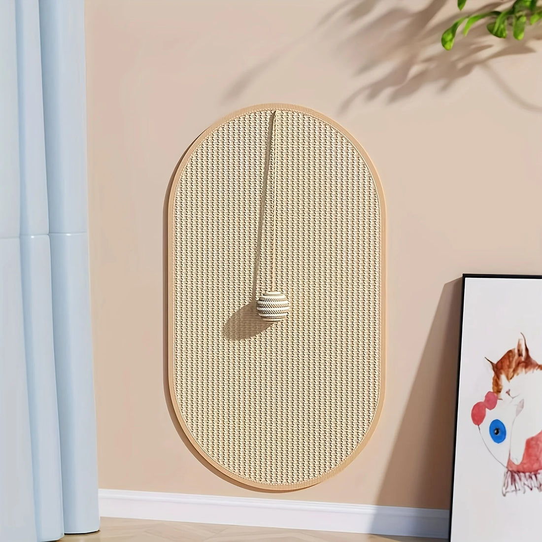 Oval sisal scratching post mat leaning against a wall